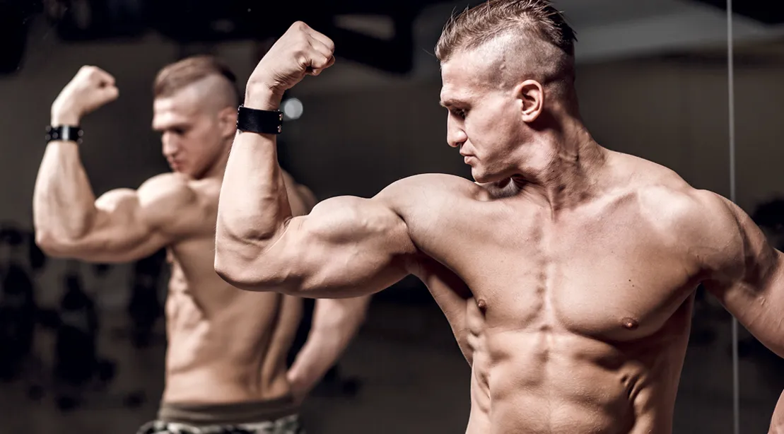 Muscular-Man-Flexing-Bicep-In-Mirror Muscular-Man-Flexing-Bicep-In-Mirror